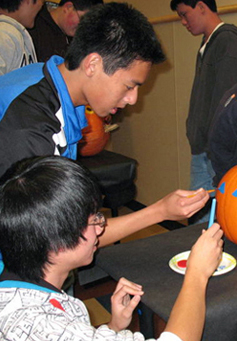 FBLA working on painting pumpkin project